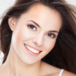 stock image of brunette female smiling towards the camera