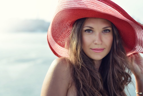Beautiful,Girl,In,A,Red,Hat,Smiling,At,The,Summer