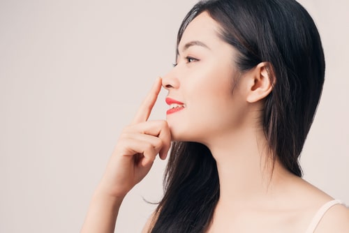 Young,Beautiful,Asian,Woman,With,Smiley,Face,And,Red,Lips