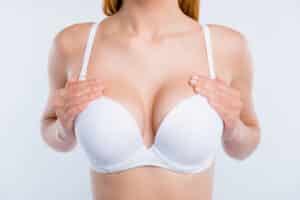 woman with large breasts in a white bra